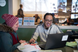 A financial coach assists a participant