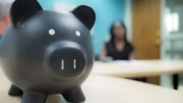 Piggy bank at a tax clinic table.